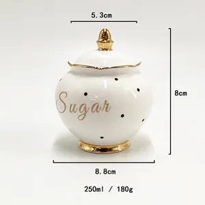 Detail of white ceramic sugar jar with gold trim and size measurements 250ml capacity