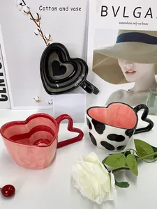Macro detail of heart-shaped ceramic mug handles with stylish creative patterns