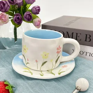 Floral ceramic tea cup set with textured finish and blue interior glaze for afternoon tea