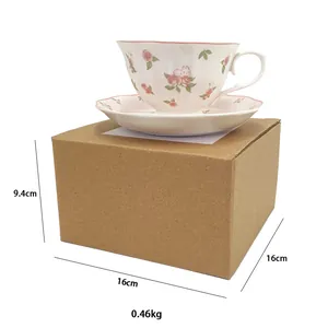 Detailed view of pastoral rose ceramic teacup set placed on its protective packaging box