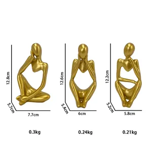Three golden abstract thinker statues for home and office decor in Nordic minimalist style