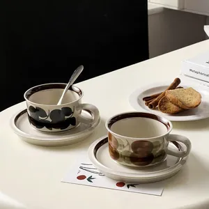 French vintage ceramic coffee cup and saucer set with retro leaf and round patterns