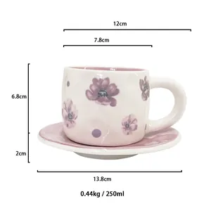 Macro view of ceramic coffee cup with floral patterns and technical dimensions