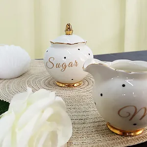 Nordic style white ceramic sugar bowl and milk jug set with gold rim and black dots