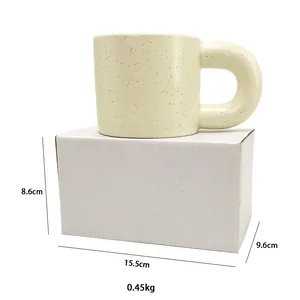Detailed view of cream ceramic mug with splash ink pattern and dimensions 15.5x9.6x8.6cm