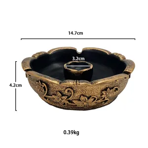 Macro shot showing dimensions and floral relief details of vintage gold candle holder
