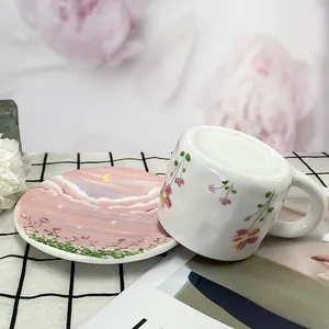 Elegant floral ceramic coffee cup and saucer set with sunset dream pattern
