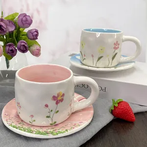Floral ceramic coffee cup and saucer set with handcrafted texture for afternoon tea