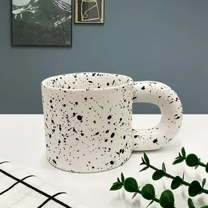 Chubby Nordic ceramic mug with black ink splash pattern and oversized round handle
