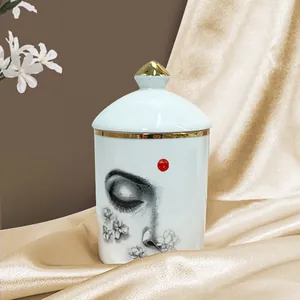 Pot de rangement en céramique avec bord doré et motif œil pour décoration