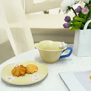Handcrafted petal-shaped ceramic coffee cup set with embossed white floral patterns