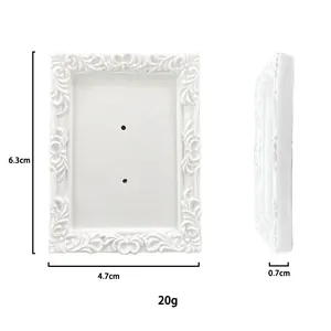 Detailed dimensions of a vintage white resin jewelry display frame with floral reliefs