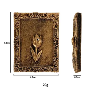 Detailed view of vintage gold tulip relief frame ornament with precise measurements