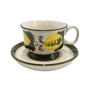 Retro hand-painted ceramic coffee cup and saucer set with yellow and dark green pattern