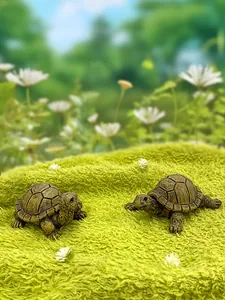 Close-up of resin turtle figurines with realistic bronze texture for garden decor