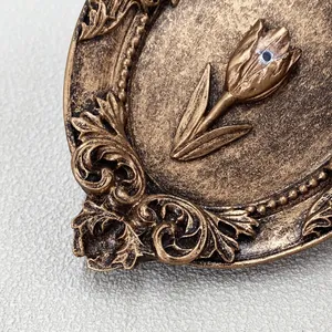 Macro detail of vintage gold tulip embossed ornament with classical European carving patterns