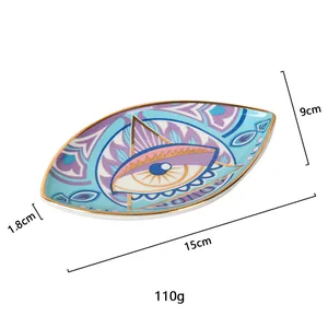 Ceramic evil eye jewelry tray with gold rim and blue mystic pattern 15cm x 9cm size