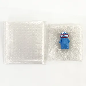 Detailed view of blue cartoon monster figurine with bubble wrap packaging for protection