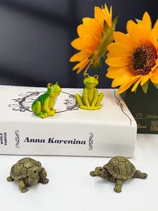 Miniature resin figurines set featuring two green frogs and two detailed brown turtles