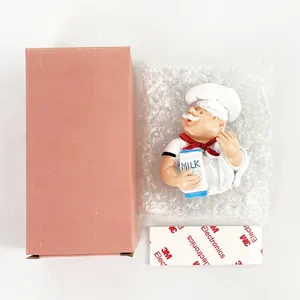 Detail view of chef-shaped power plug holder with packaging box and 3M adhesive sticker