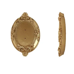 Golden baroque oval earring display stand with vintage embossed details and dual viewpoints