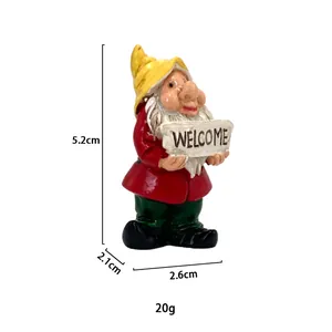 Close-up of garden gnome resin statue with Welcome sign and dimension measurements