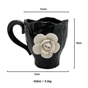 Detail view of 420ml black ceramic mug with 3D white camellia flower and dimension specs