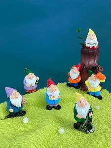 Detailed set of seven garden gnome resin fridge magnets on synthetic grass background