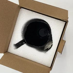 Detailed top view of black ceramic floral mug in protective foam and cardboard packaging