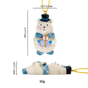 Detailed size specifications of the polar bear ornament with blue polka dot scarf