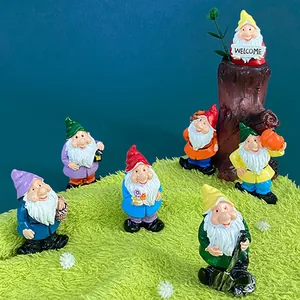 Set of 7 colorful garden dwarf refrigerator magnets with various tools and welcome sign