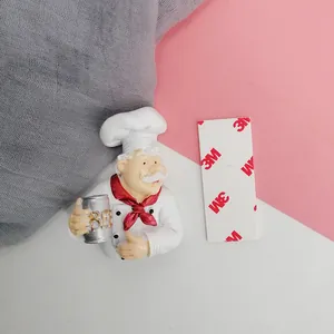 Detailed view of chef figurine plug hook with 3M adhesive tape for wall mounting