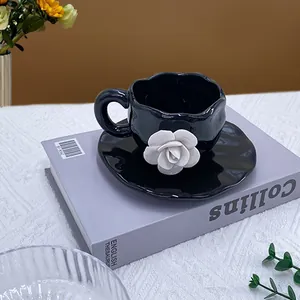 Ceramic Coffee Cup And Saucer With 3D White Rose Flower Relief Glossy Black Finish Irregular Wavy Edge French Vintage Jewelry Style