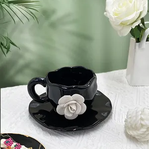 Artistic 3D white rose ceramic coffee cup set with black irregular saucer and relief