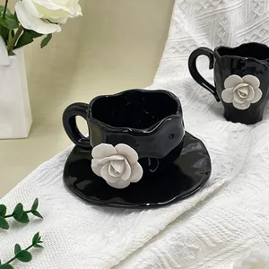 Black ceramic coffee cup and saucer set with 3D white camellia flower decoration