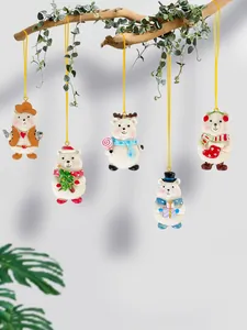 Set of five resin Christmas bear ornaments with festive accessories hanging on a branch