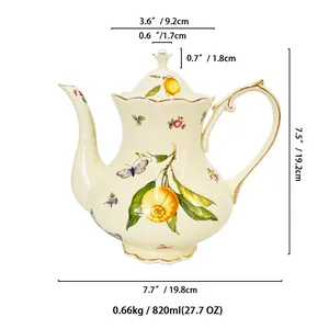 European vintage ceramic teapot with lemon floral motifs and elegant gold trim details