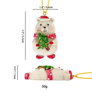 Christmas polar bear resin ornament with red scarf and tree, including size measurements