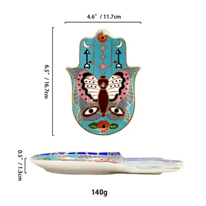 Keramik-Schmuckschale in Hamsa-Hand-Form mit Schmetterlingsdekor und Goldrand