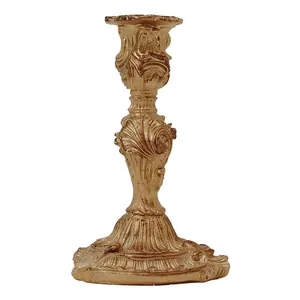 Vintage Baroque gold candle holder with ornate embossed leaf patterns and retro finish