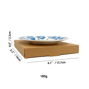 Détail du plateau à bijoux œil en céramique 16 cm montrant les dimensions et l'emballage