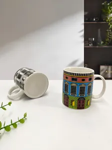 Detail of ceramic mugs with intricate black and white and colored Italian architecture motifs