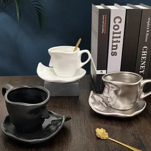 Artistic face relief ceramic coffee cup and saucer set with gold spoon in three colors