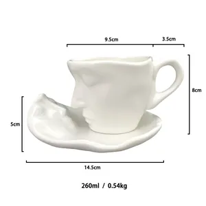 Artistic white ceramic coffee cup and saucer set with face relief and 260ml capacity