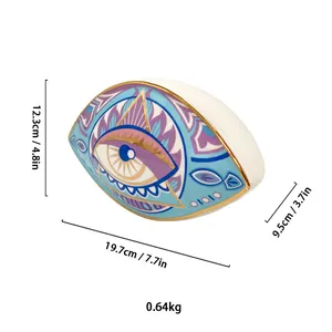 Detailed view of evil eye ceramic ornament with dimensions 19.7x12.3x9.5cm and weight 0.64kg