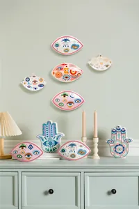 Artistic Nordic evil eye ceramic decor set on a mint green cabinet for home styling