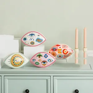 Detail of Nordic style ceramic Evil Eye trays in pastel colors for home decor