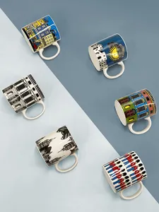Detailed view of six ceramic mugs with vintage London architecture hand-painted illustrations