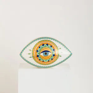 Detail of Nordic ceramic eye dish with intricate mandala pattern and gold gilded edges