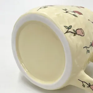 Close-up of non-slip base and floral knit texture on handmade ceramic coffee mug